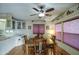 Bright dining room featuring laminate wood flooring, overhead fan and lots of natural light at 7750 E Broadway Rd # 225, Mesa, AZ 85208