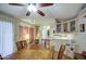 Cozy kitchen and dining area featuring wooden table and chairs with adjacent updated appliances at 7750 E Broadway Rd # 225, Mesa, AZ 85208