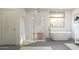 Luxurious bathroom featuring a standalone tub and a glass-enclosed shower at 7994 W Griswold Rd, Peoria, AZ 85345