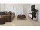 Relaxing loft space with a comfortable couch, stylish decor, and ample natural light at 7994 W Griswold Rd, Peoria, AZ 85345