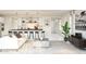 Open-concept design featuring a spacious kitchen seamlessly connected to the living area, bathed in light at 7994 W Griswold Rd, Peoria, AZ 85345
