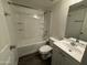 Bathroom with a vanity, mirror, bathtub, and toilet at 808 N 67Th Ln, Phoenix, AZ 85043