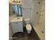Bathroom featuring a vanity, toilet, and walk-in shower at 808 N 67Th Ln, Phoenix, AZ 85043