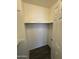 A small empty closet with a door that is slightly open at 808 N 67Th Ln, Phoenix, AZ 85043