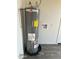 Water heater with a black tray underneath it at 808 N 67Th Ln, Phoenix, AZ 85043