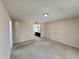 This bedroom includes neutral carpeting, white trim and paint, and an ensuite bath at 9059 N Arroya Grande Dr, Phoenix, AZ 85028