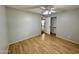 Bedroom showcasing hardwood floors, a ceiling fan and large closet at 9059 N Arroya Grande Dr, Phoenix, AZ 85028