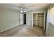 Cozy bedroom featuring carpet, ceiling fan, and closet at 9059 N Arroya Grande Dr, Phoenix, AZ 85028