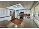 Bright kitchen featuring ample white cabinetry, stainless steel appliances, and wood flooring at 9059 N Arroya Grande Dr, Phoenix, AZ 85028
