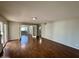 Hardwood floors in a spacious living room open to additional rooms and patio access at 9059 N Arroya Grande Dr, Phoenix, AZ 85028