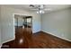 Bright living room featuring hardwood floors and a ceiling fan at 9059 N Arroya Grande Dr, Phoenix, AZ 85028