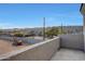 Balcony view shows a mountain view, partial view of a construction dig and block wall at 921 E Desert Ln, Phoenix, AZ 85042