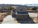 A modern home featuring a sleek design and offering scenic mountain views in the background at 921 E Desert Ln, Phoenix, AZ 85042