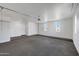 A well-lit garage with plenty of storage space and potential for various uses at 921 E Desert Ln, Phoenix, AZ 85042