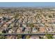 Wide aerial view of residential area with houses, streetscapes, and desert vistas in the distance at 9654 E Pantera Ave, Mesa, AZ 85212