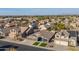 An elevated neighborhood view with single-Gathering homes, palm trees, and desert landscape at 9654 E Pantera Ave, Mesa, AZ 85212