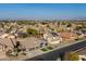 A high-angle aerial view of neighborhood houses showing mountain views in the background at 9654 E Pantera Ave, Mesa, AZ 85212