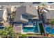 An overhead perspective of a home with a large backyard, pool, patio, and desert landscaping at 9654 E Pantera Ave, Mesa, AZ 85212