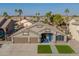 Charming single-story home featuring a three-car garage and a welcoming blue front door at 9654 E Pantera Ave, Mesa, AZ 85212