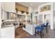 Kitchen with a large island, stainless steel appliances, and stylish blue chairs at 9654 E Pantera Ave, Mesa, AZ 85212
