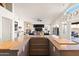 Gourmet kitchen with an island and a view of the fireplace and living area at 9654 E Pantera Ave, Mesa, AZ 85212