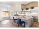 Kitchen with a large island, stainless steel appliances, and natural lighting at 9654 E Pantera Ave, Mesa, AZ 85212