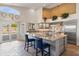 Kitchen with a large island, stainless steel appliances, and natural lighting at 9654 E Pantera Ave, Mesa, AZ 85212