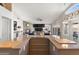 Gourmet kitchen with an island and a view of the fireplace and living area at 9654 E Pantera Ave, Mesa, AZ 85212