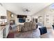 Cozy living room features a stone fireplace, slate floors, and a comfortable reclining sofa at 9654 E Pantera Ave, Mesa, AZ 85212