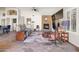 Spacious living room with a stone fireplace, slate floors, and comfortable seating at 9654 E Pantera Ave, Mesa, AZ 85212
