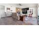 Cozy living room featuring a fireplace, comfortable seating, and natural stone flooring at 9654 E Pantera Ave, Mesa, AZ 85212