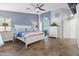Inviting main bedroom featuring a ceiling fan, closet, and dresser at 9654 E Pantera Ave, Mesa, AZ 85212