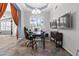 Home office featuring ample natural lighting, tiled floors, and a modern decor at 9654 E Pantera Ave, Mesa, AZ 85212