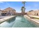 Home exterior showcasing a fabulous pool with water feature, lounge seating and lush landscaping at 9654 E Pantera Ave, Mesa, AZ 85212