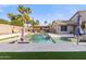 Beautiful backyard with a pool, outdoor kitchen, landscaped areas, and a covered patio at 9654 E Pantera Ave, Mesa, AZ 85212