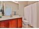 Bathroom features a vanity with generous counter space, cabinet storage, and a shower, offering a functional design at 10022 W Luxton Ln, Tolleson, AZ 85353