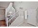 Bright entryway with staircase, tile flooring and an accent wall at 10022 W Luxton Ln, Tolleson, AZ 85353