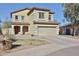 Attractive two-story home with desert landscaping and a spacious two-car garage at 10022 W Luxton Ln, Tolleson, AZ 85353