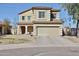 Charming two-story home featuring a two-car garage and well-maintained front yard at 10022 W Luxton Ln, Tolleson, AZ 85353