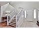 Inviting foyer with staircase and tile flooring at 10022 W Luxton Ln, Tolleson, AZ 85353