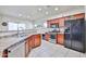 Well-equipped kitchen features stainless steel appliances and ample counter space at 10022 W Luxton Ln, Tolleson, AZ 85353