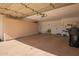 Spacious garage with white walls, built-in storage cabinets, and a black trash can at 10056 E San Bernardo Dr, Scottsdale, AZ 85258