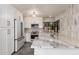 Modern kitchen featuring white cabinets, quartz countertops, and new stainless appliances at 10056 E San Bernardo Dr, Scottsdale, AZ 85258
