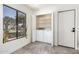 Functional laundry room with washer, dryer, and natural light at 10056 E San Bernardo Dr, Scottsdale, AZ 85258
