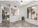 Living room with pass-through to dining area and outdoor view at 10056 E San Bernardo Dr, Scottsdale, AZ 85258