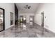 Bright and airy living room with high ceilings and floor to ceiling fireplace at 10056 E San Bernardo Dr, Scottsdale, AZ 85258