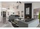 Bright and airy living room with high ceilings, sleek fireplace, and stylish furnishings at 10056 E San Bernardo Dr, Scottsdale, AZ 85258