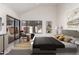 Cozy main bedroom with a large window, neutral decor, and contemporary furnishings at 10056 E San Bernardo Dr, Scottsdale, AZ 85258