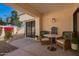 Charming outdoor patio with comfortable seating and view of lush landscaping at 10056 E San Bernardo Dr, Scottsdale, AZ 85258