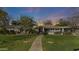 Beautiful home exterior with lush green lawn and inviting stone pathway at 1018 W Kaler Dr, Phoenix, AZ 85021